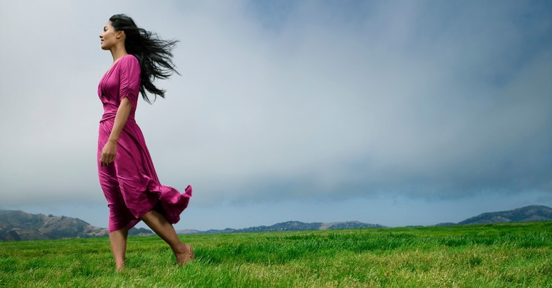 woman standing in flowing dress in field looking into the distance, prayers for hidden strength