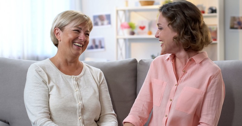 woman with godmother laughing and talking