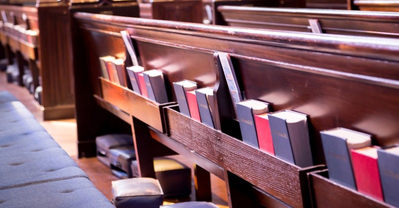 Bibles and hymnals in church pews