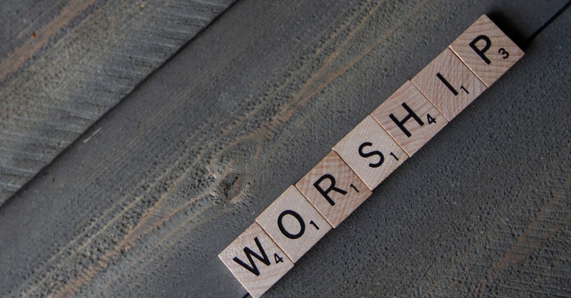 scrabble tiles spelling the word worship