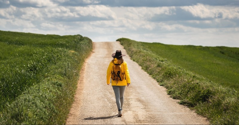 Woman walking a unknown path