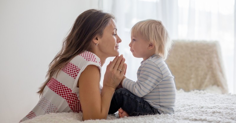 mom and toddler praying for an abundant life together