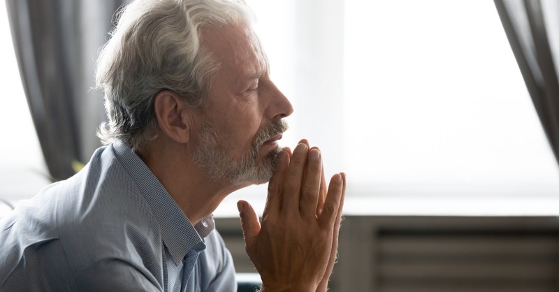 elderly man praying for abundant life