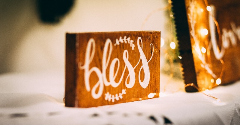 Bless plaque on a fireplace