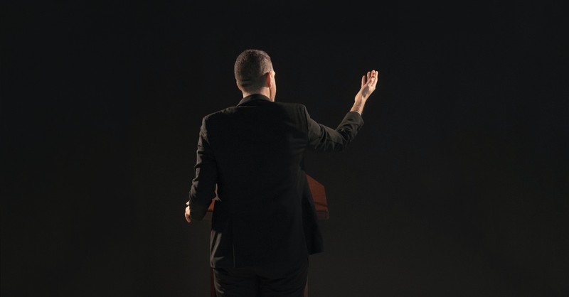 A man speaking at a podium