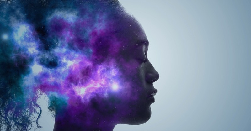 abstract image of woman's head with cosmic images overlayed