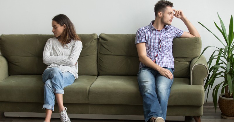 couple sitting apart not talking because of argument