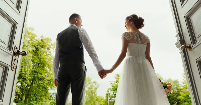 bride and groom holding hands at wedding, what is covenant marriage