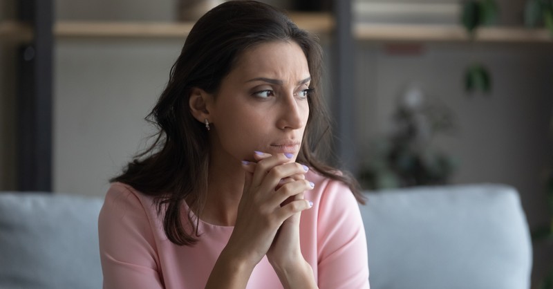 woman looking hopeless praying thankful grateful