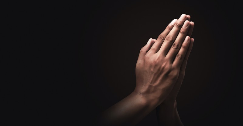 prayer hands against black background, ways to redeem halloween