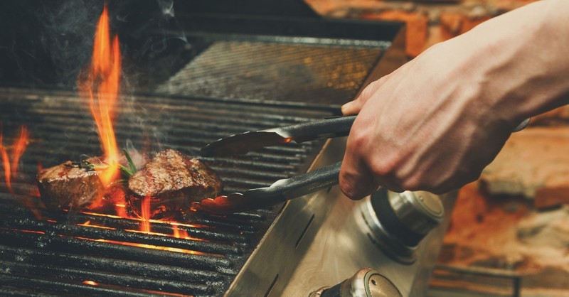 Man grilling some steaks