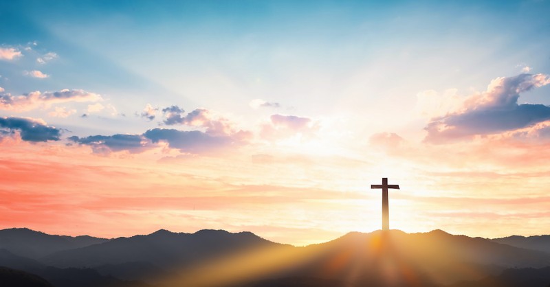 silhouette of Cross at sunset in beautiful scenic outdoors