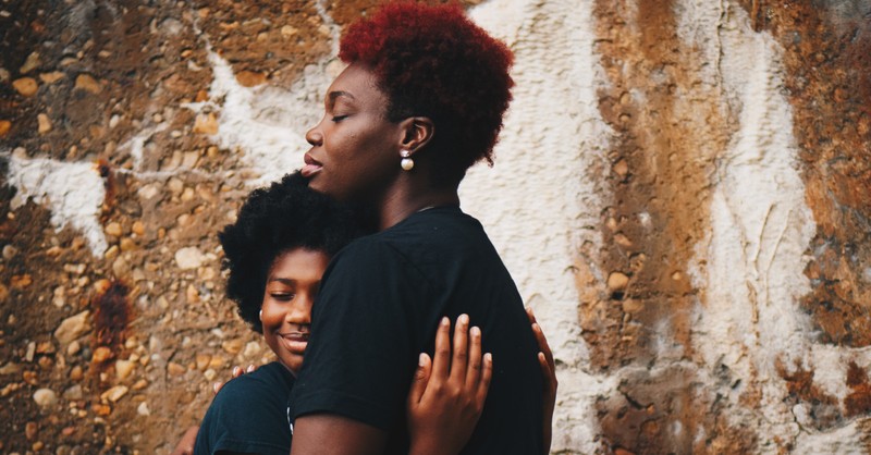 a mother and daughter hugging, how Christians should view critical race theory