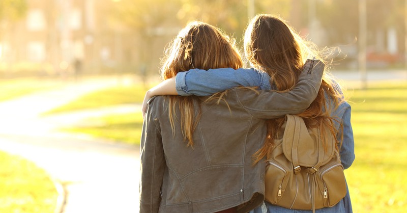 two friends hugging each other, love is patient love is kind