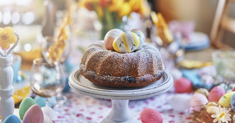 Easter dinner table with cake and Easter eggs