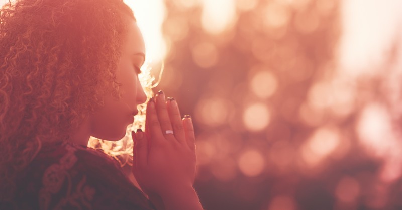 woman praying outside