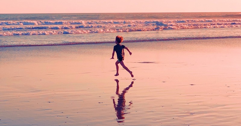 little boy running on a beach at sunset, bible verses about life