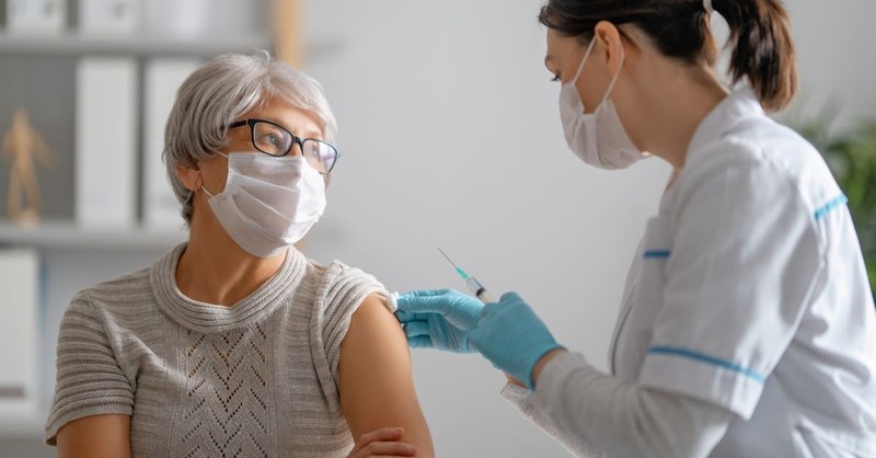 elderly woman getting covid-19 vaccine vaccination coronavirus