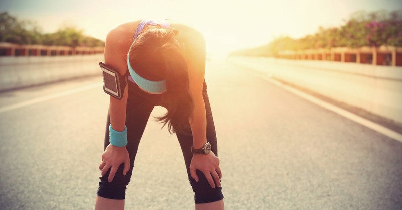 Tired woman resting after a run