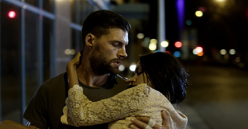 A man holding a woman in Priceless