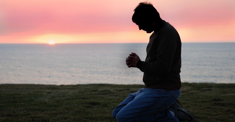 Man kneeling in Prayer