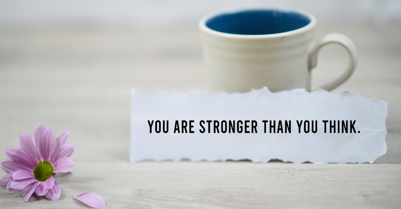 Mug and flower with a note saying you are strong than you think