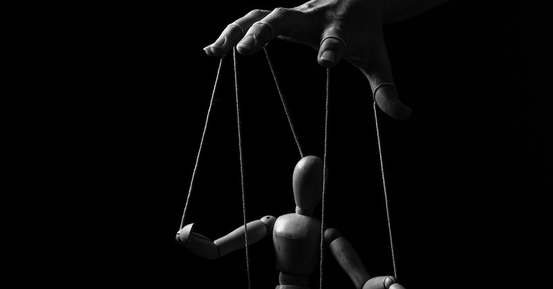 fingers controlling marionette, you are not your own