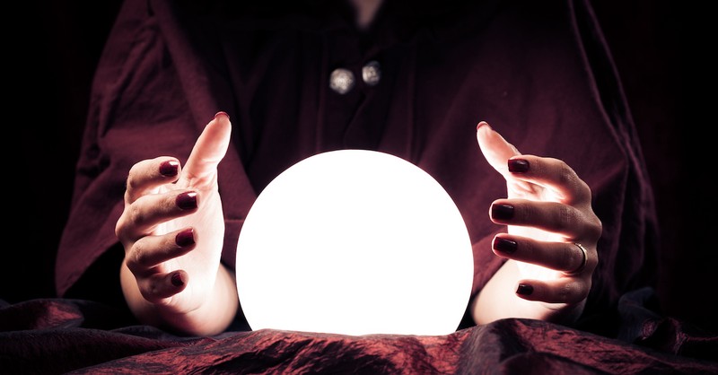 hands around a crystal ball, what does the Bible say about mediums