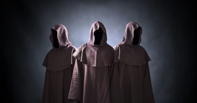 dark figures in cloaks, unholy trinity