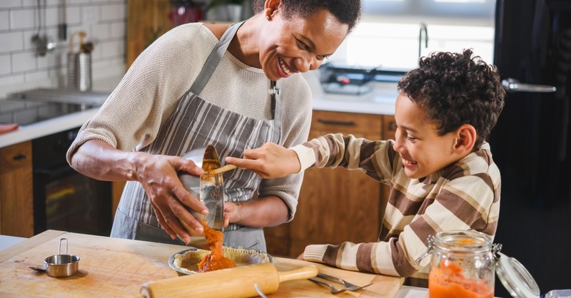 Mom and son baking a pumpkin pie