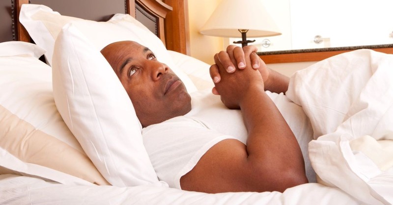 man praying in bed, walk in the spirit