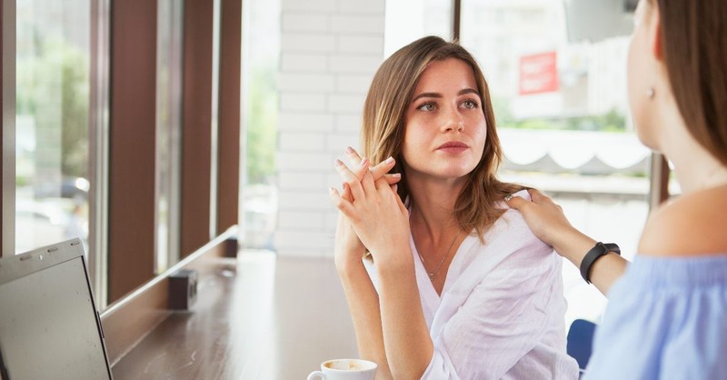 Woman looking annoyed at her 'friend'