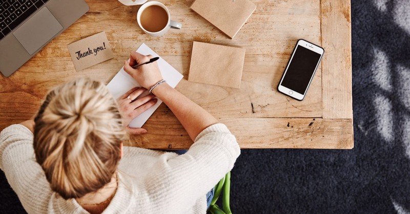 Woman writing thank you notes