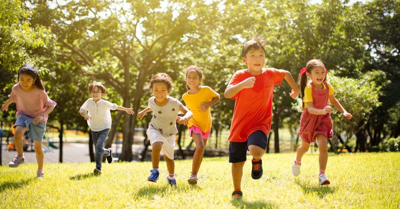 Children running through a field