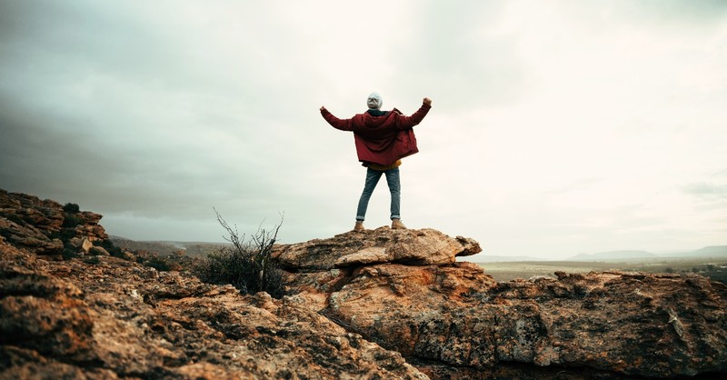 Man standing on a rock cliff
