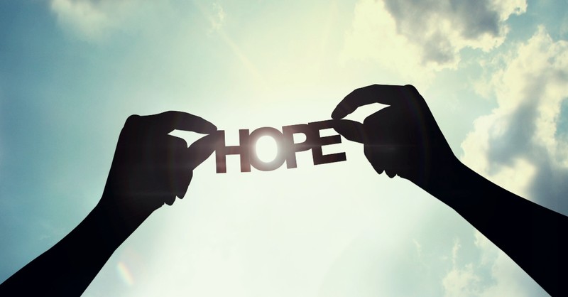 Word hope silhouetted against a blue sky, helen keller quotes about hope