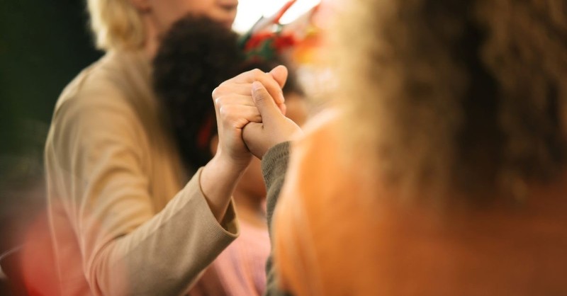 people holding hands praying at table, helen keller quotes about faith