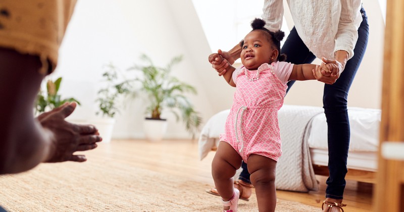 baby girl taking steps