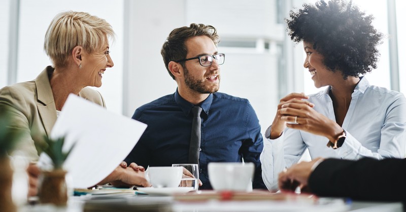 Men and women talking at work