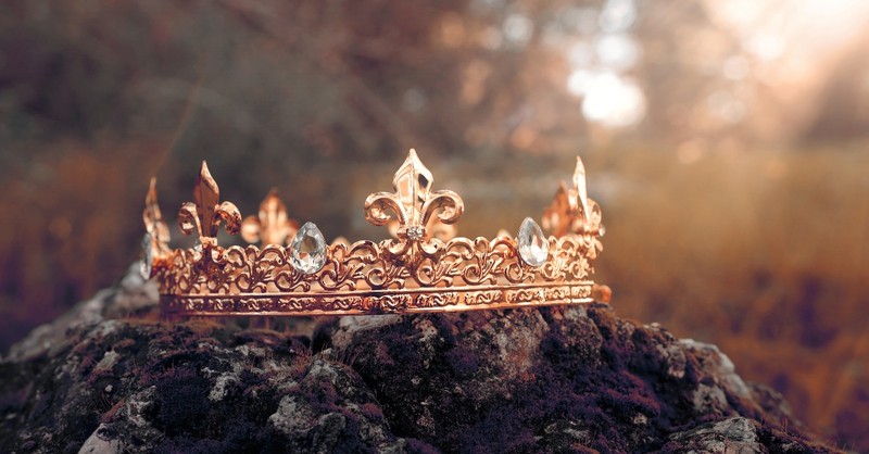 Rose gold crown on a rock