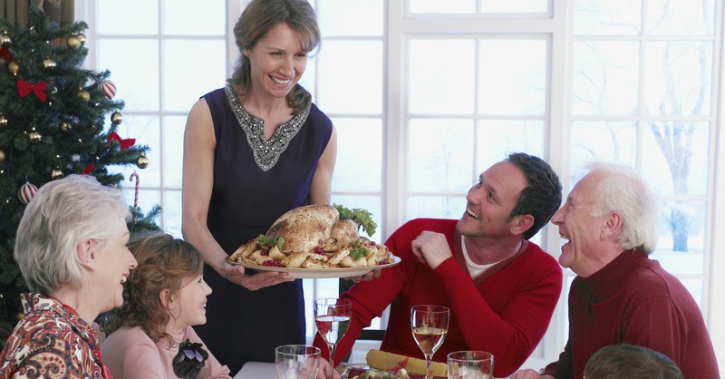 woman serving Christmas dinner