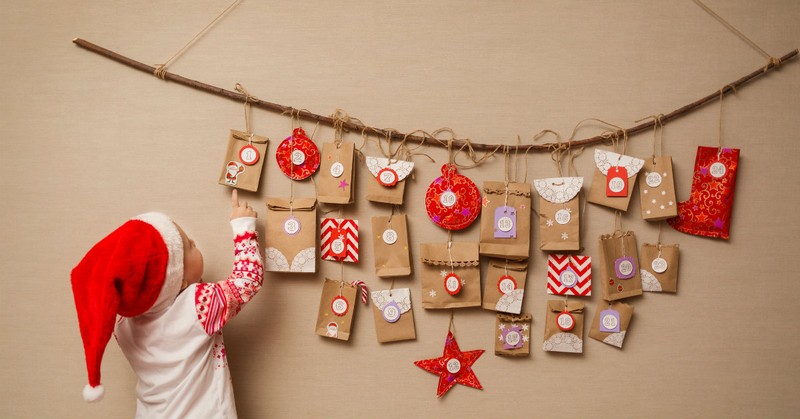 Child with a homemade advent calendar