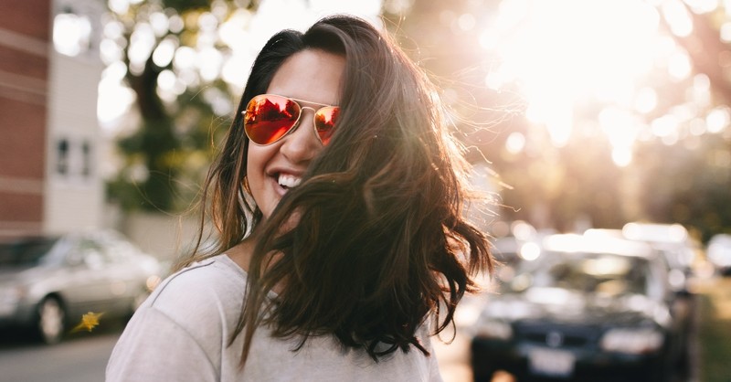 happy woman laughing walking on street