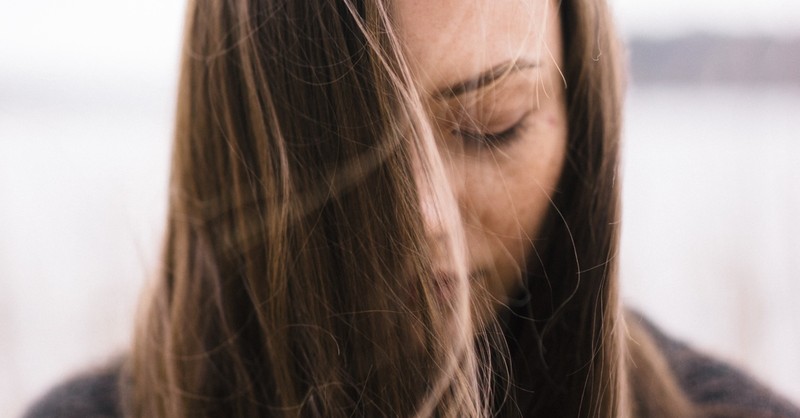 woman with eyes closed looking peaceful