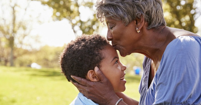 grandmom kissing grandson's head