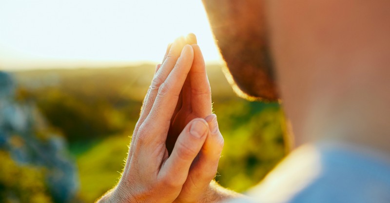 Close-up of a man praying