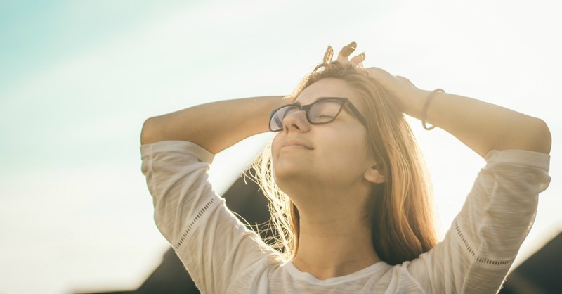 woman looking to the sky, peaceful