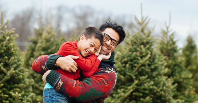 dad and son at christmas tree farm