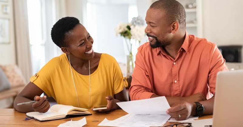 black couple smiling at each other