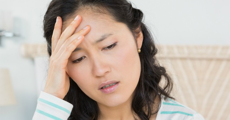 woman looking upset and anxious